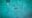 Birds eye view shot of a crystal clear teal blue sea with a whale shark centred in the image.