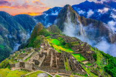 Machu Picchu inca ruins, Cusco,Peru Overview of the lost inca city Machu Picchu, agriculture terraces and Wayna Picchu, peak in the background,before sunrise