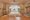 an lam retreats bedroom with white netting draping