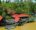 a jungle lodge with red roof perched on the sidebanks of kinabatangan river in Borneo - Abai Jungle Lodge -Borneo