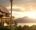 beautiful lodge located in the hills between lush rainforest overlooking the sea at sunset - Gaya Island Resort in Borneo