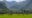mai chau eco lodge in vietnam from the distance with hills in the back ground
