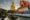 Big Buddha Dhammakaya Tep Mongkol Buddha of Paknam Bhasicharoen temple in Thonburi in Bangkok city against the backdrop of sunset and canal