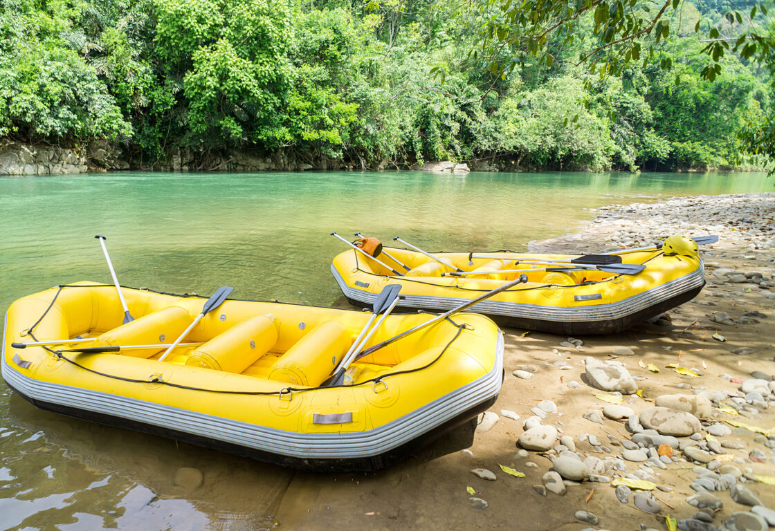 two yellow rafts on the edge of Kiulu River in Borneo
