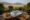 table on a balcony overlooking a river and mountains