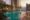 rooftop pool at oasia downtown with buildings of singapore surrounding