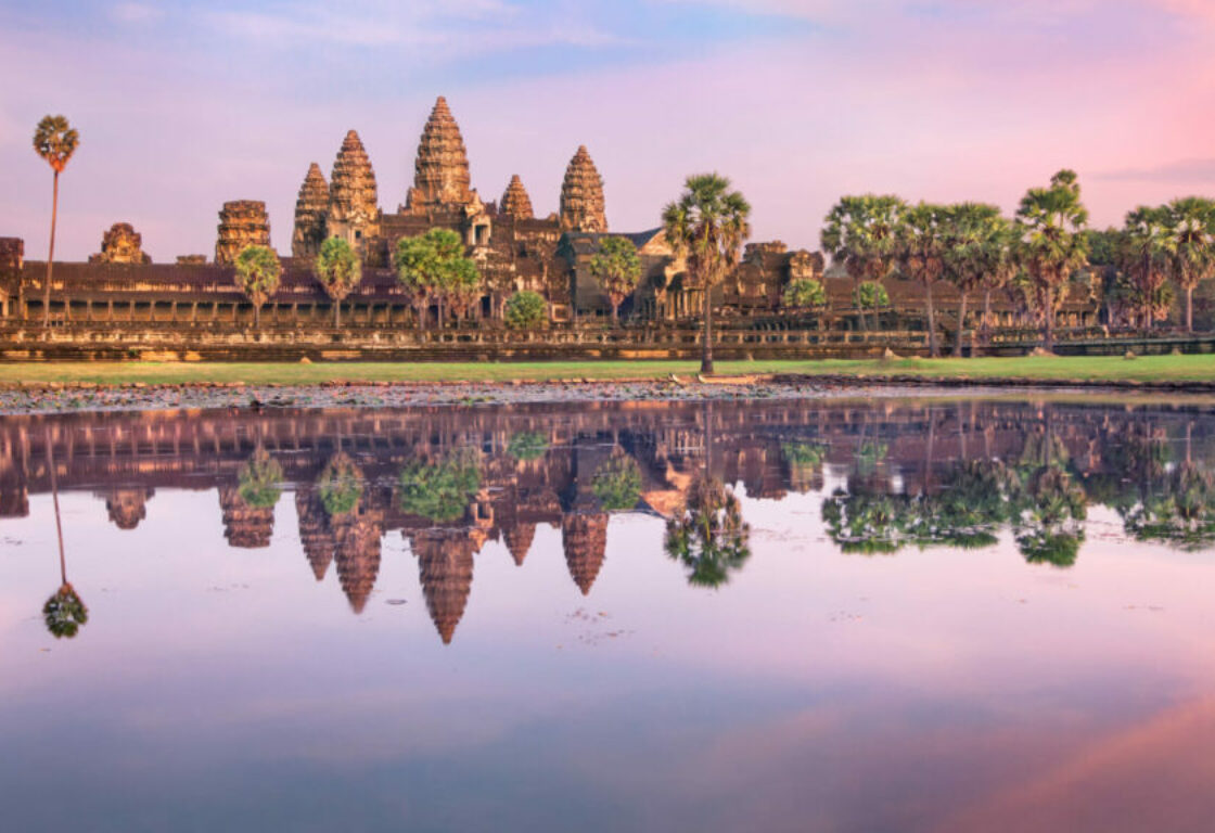 pink sky over angkor wat in siem reap - temples with 5 pointy towers
