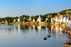BATESHWAR Temples featuring simple white buldings on water