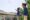 Dera Mandawa in india two men in blue skirts stand on a balcony flying a kite