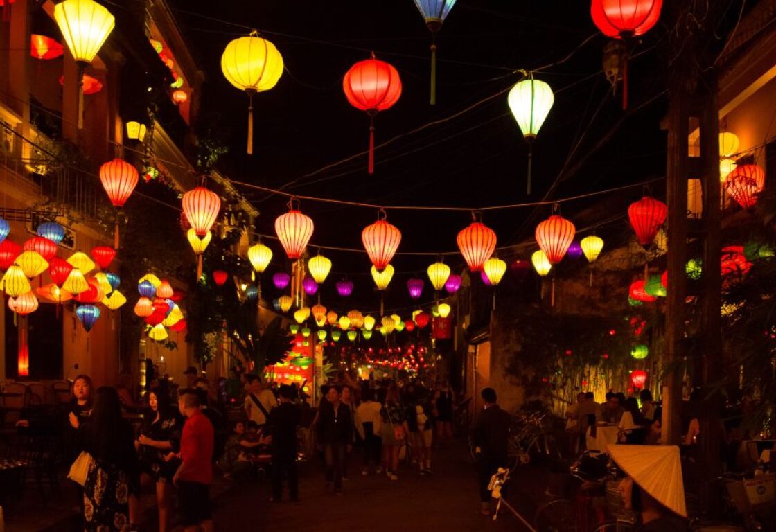 hoi at night lit up by lanterns in the street