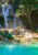 the kuang si waterfalls cascading down through tropical jungle, into a large turquoise blue pool at the bottom in laos