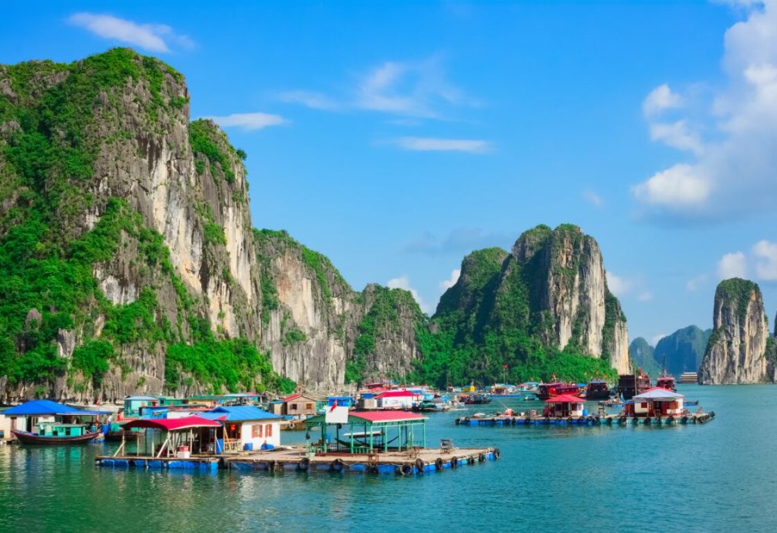 limestone karsts in ha long bay at a floating village