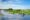 group of women paddling on small boats down the mekong delta collecting flowers in the boats