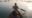 Sarai at Toria in india photo taken behind a man and a woman in a small wooden boat as the man used an oar to cross a lake