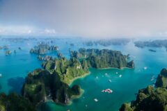 aerial view of ha long bay landscape with karts and boats