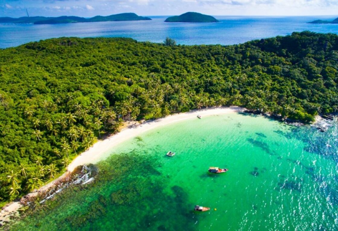 aerial view of phu quoc with tree fringed palm beach and the sea is a variety of blues and greens in colour