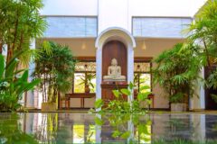 front of Niyagama House with Buddha statue