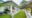front building at Ashburnham Estate - white bungalow with green area surrounding it