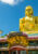 gold large budha sitting atop a temple in Dambulla