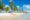Tropical beach scene with palm trees, a thatched hut, and a yellow kayak on white sand. Clear blue sky and tranquil ocean convey a serene, relaxing atmosphere.