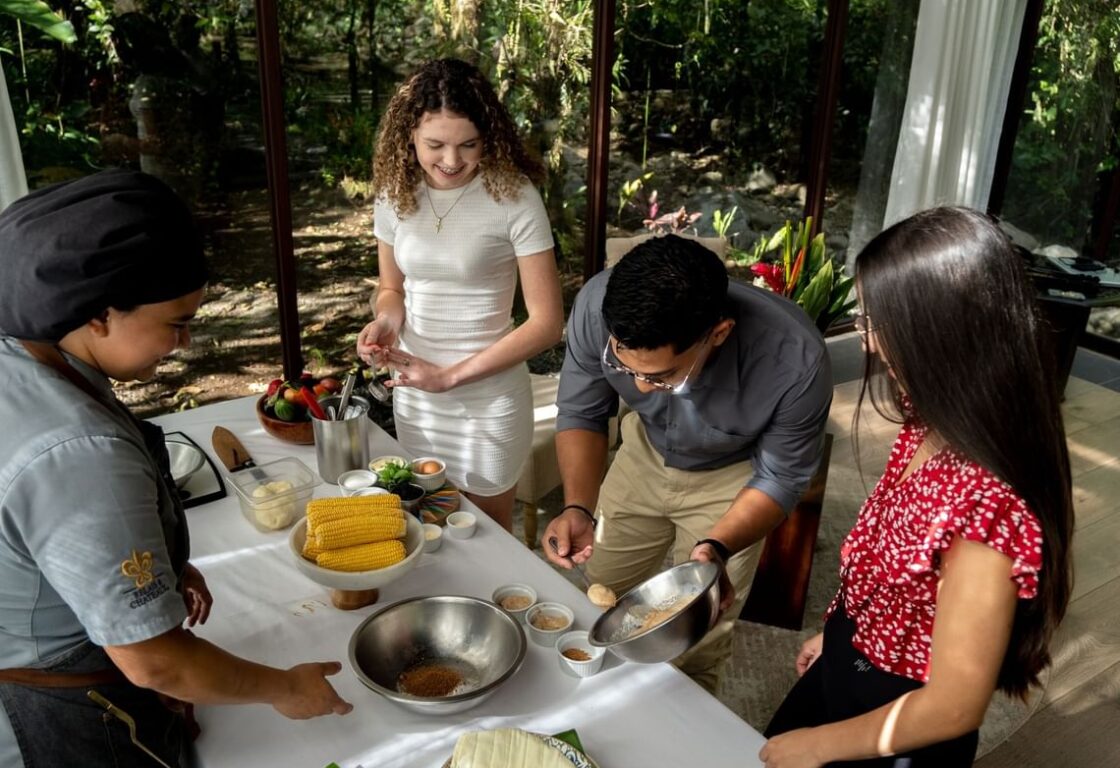 a group of people learning to cook local cuisine in Costa Rica - cooking class