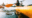 a woman in a yellow kayak paddling on a lake