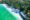 Aerial photo of deserted white sandy beach backing onto a forest