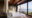 stunnin gsignature suite featuring full wall glass window overlooking the ocean, double bed in the middle