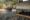 observation deck with a man taking photos of elephants at waterhole