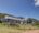 a front building of Blue Gum Country Estate on the lawn with loungers