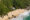 aerial view of a beach lodge with huts scattered in the surrounding trees, facing the beach and ocean in Mozambique