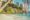 Tropical beach scene with white sand, turquoise sea, and lush greenery. A house is nestled among trees, and palm fronds frame the serene landscape.