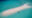 a strip of a sandy spot in the middle of the ocean