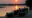 sunset game drive by a lake with people sitting by a lake