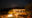 a view of a bush camp building lit up at night