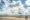 two people walking on the beach
