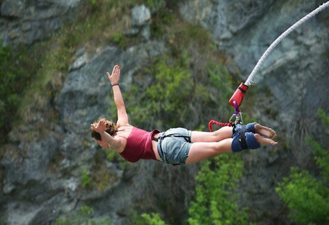 a woman on a rope bungee jumping