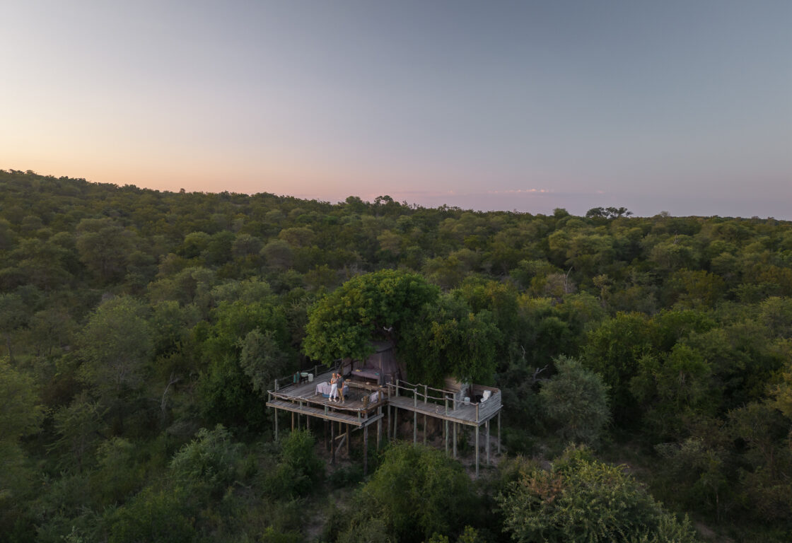 a sleep out deck on high stilts perched in the middle of african bush