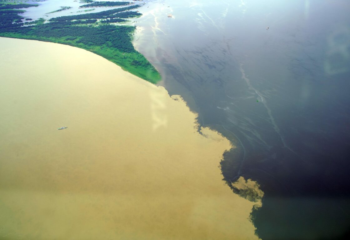 The Meeting of Waters is the confluence between the Rio Negro, a river with dark (almost black coloured) water, and the sandy-coloured Amazon River or Rio Solimões. The confluence is near Manaus.