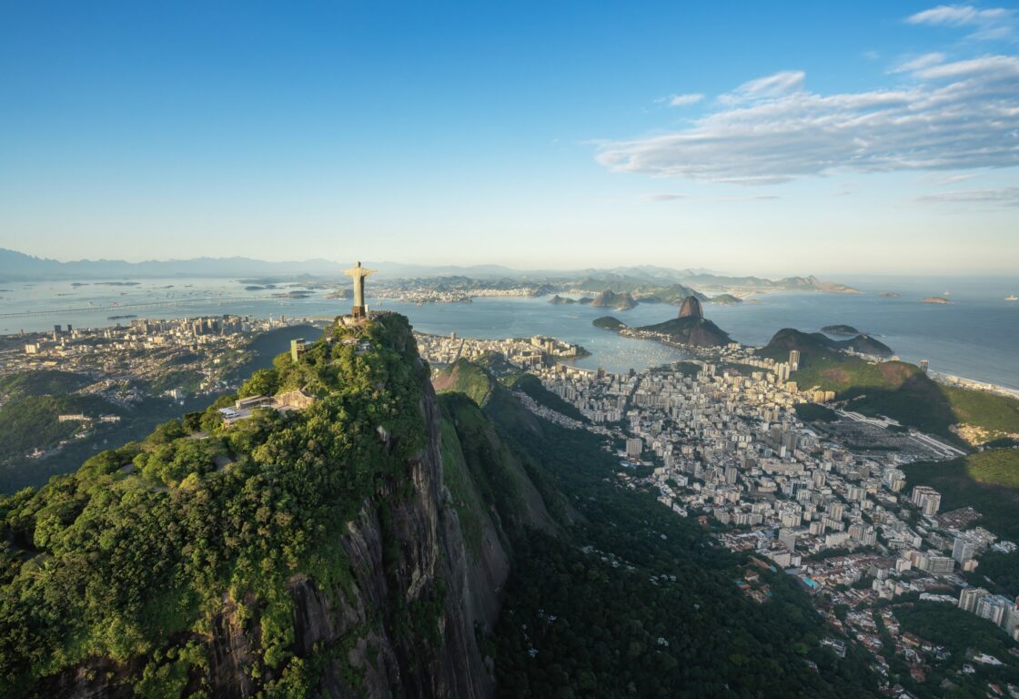 Aerial view of the Rio de Janeiro skyline, with Corcovado and Cristo Redentor in foreground