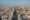 Aerial shot of a city lanscape with high rise buildings stretching for miles with a wide boulevard
