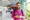 Friendly guide in India with phone in hand