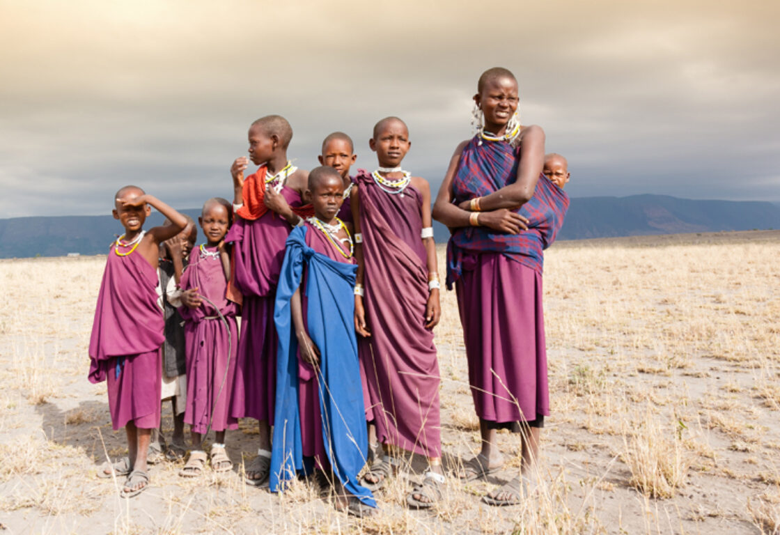 Maasai children standing in a group in colourful clothing in Tanzania