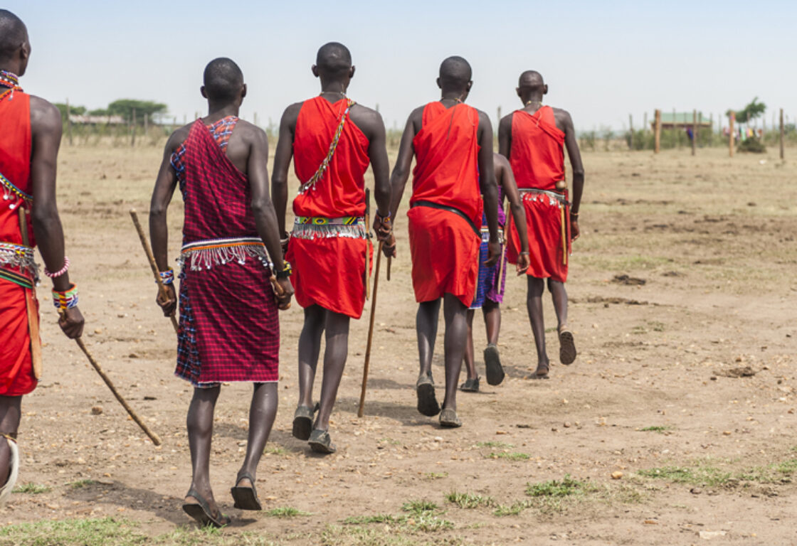 maasai mara warriors walking in a row