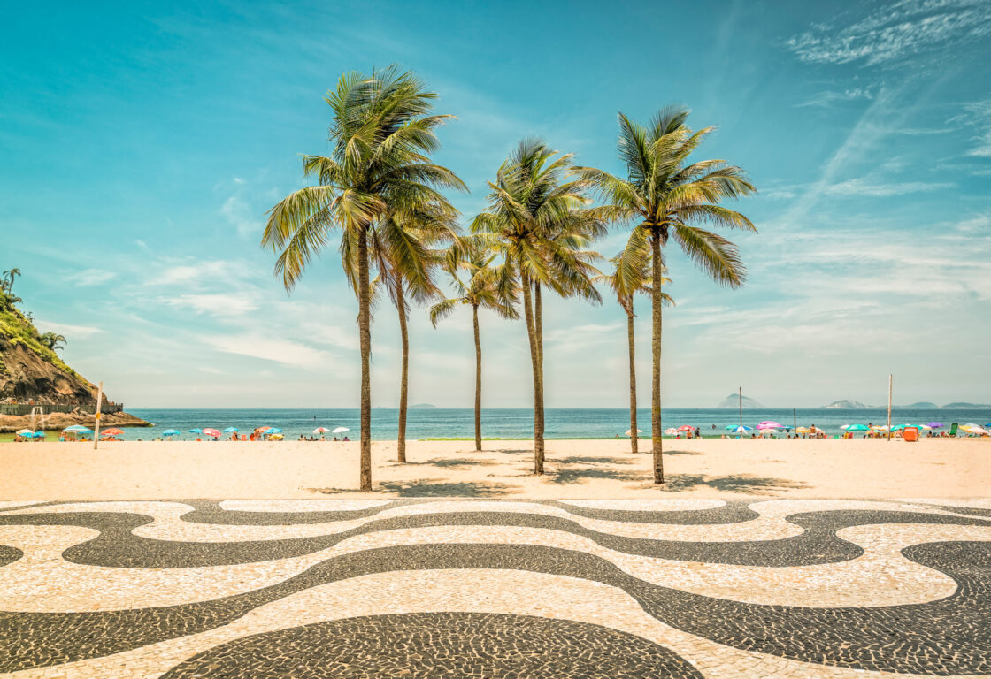 Palms on Copacabana Beach and landmark mosaic in Rio de Janeiro, Brazil