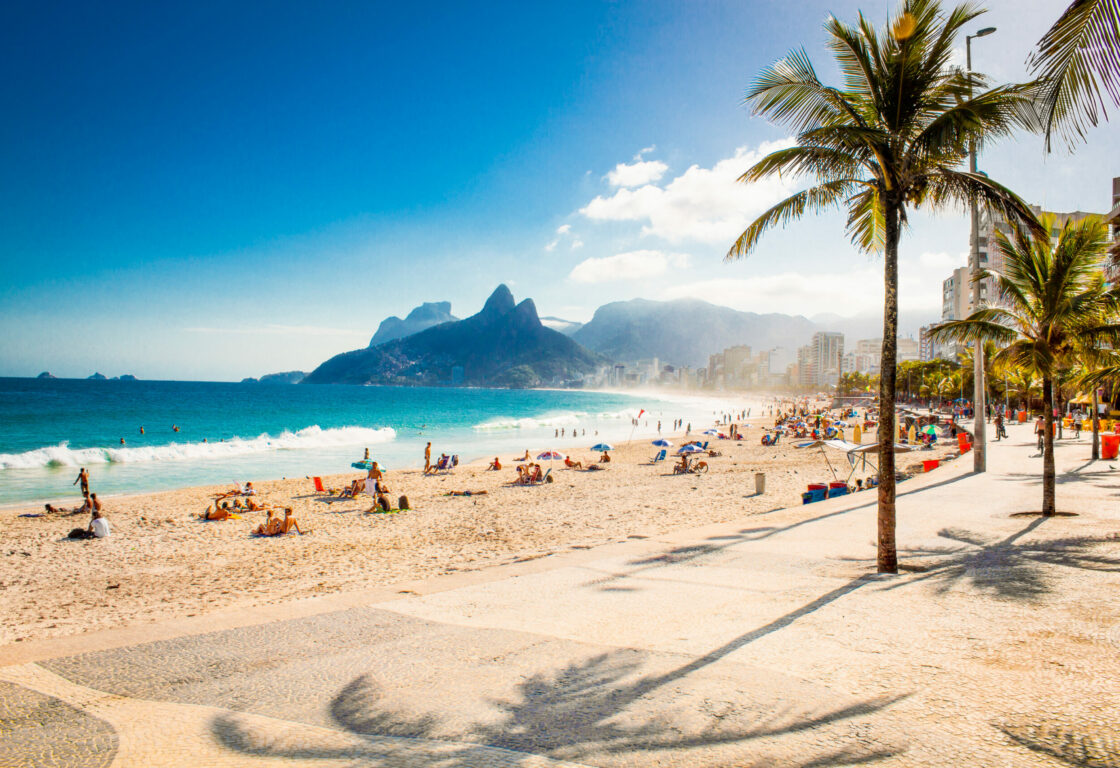 Palms and Two Brothers Mountain on Ipanema beach in Rio de Janeiro. Brazil.