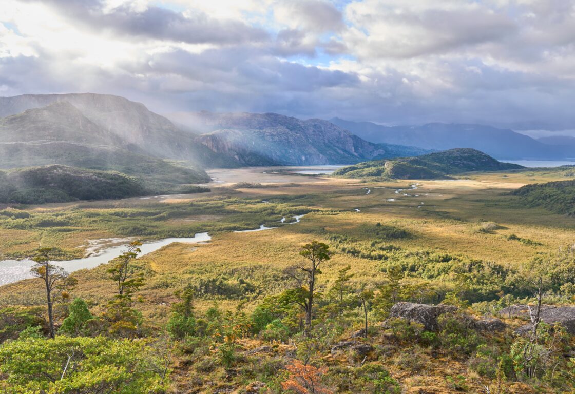 landscape of wide valley near town Villa O'Higgins, Chile. Lake Cisnes in the background