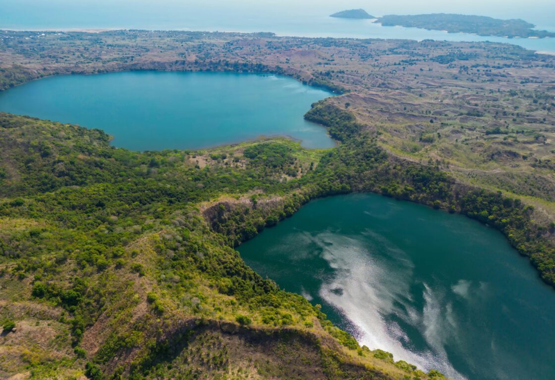 Aerial view from Mont Passot over the crater lake Lac Amparihibe and the Indian Ocean, Nosy Be, Madagascar.