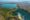 Aerial view from Mont Passot over the crater lake Lac Amparihibe and the Indian Ocean, Nosy Be, Madagascar.