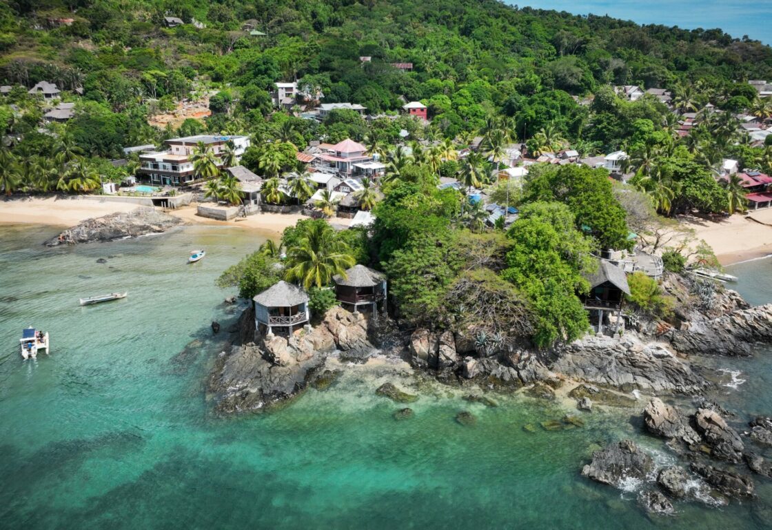 Aerial view of Nosy Komba Island revealing serene beaches and lush greenery in Madagascar